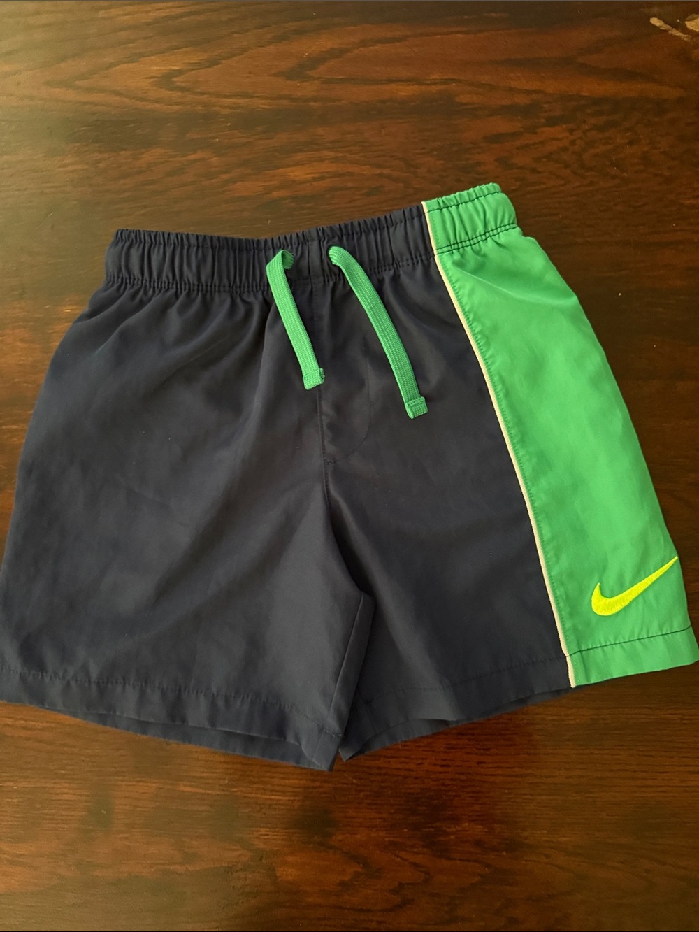 Nike Kids Navy and Green Athletic Shorts with Yellow Swoosh
